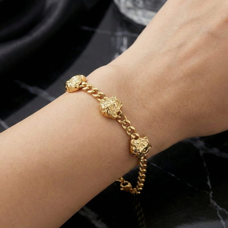 A stylish gold bracelet made of rust-resistant stainless steel, with a wide chain design and three luxurious prominent tiger-shaped heads, with an adjustable clasp to fit you. - Image 2